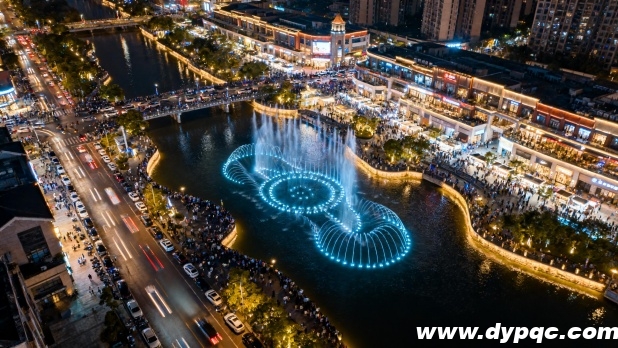 航拍大型河道喷泉的夜经济景象